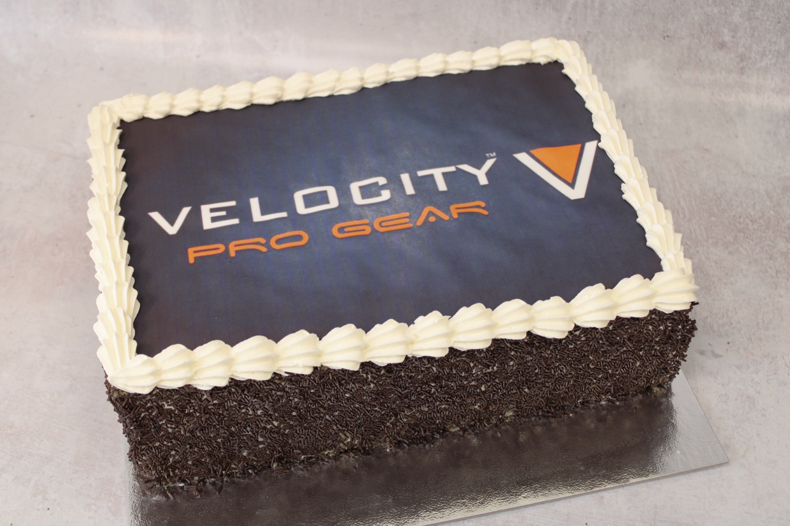 Velocity Pro Gear branded corporate logo cake, second angle