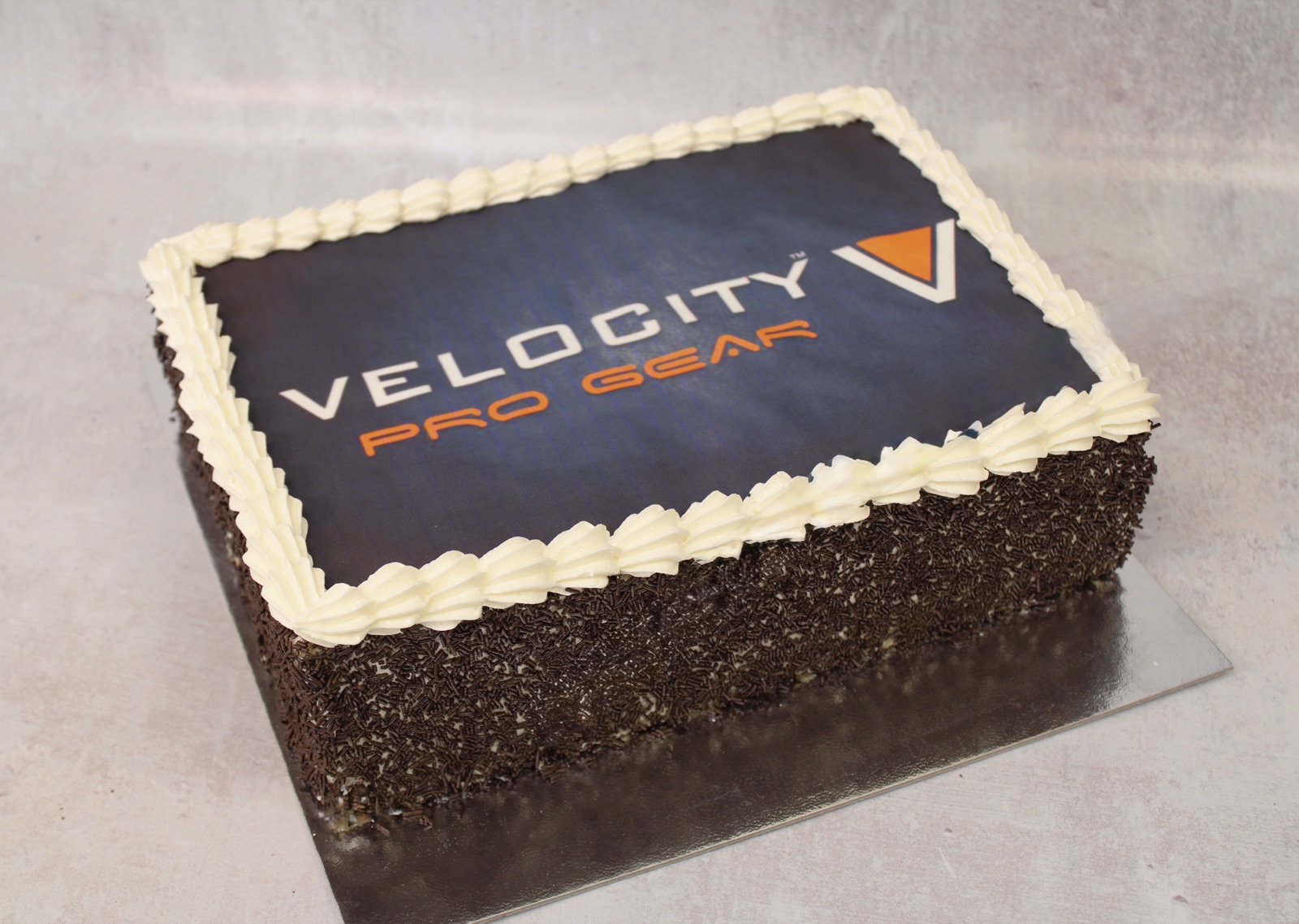 Velocity Pro Gear branded corporate logo cake from Knotts Bakery