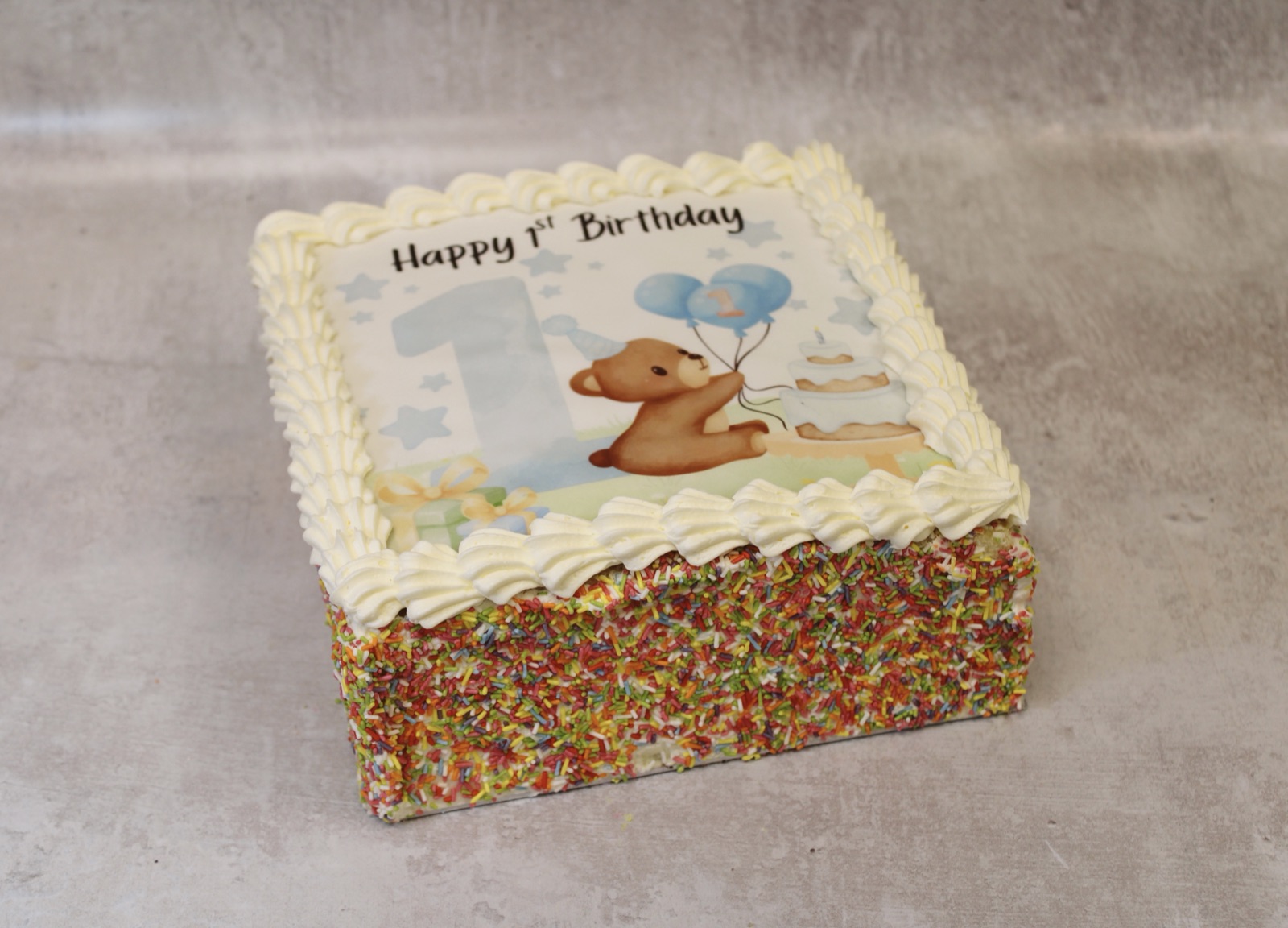 Happy 1st Birthday teddy bear picture cake from Knotts Bakery