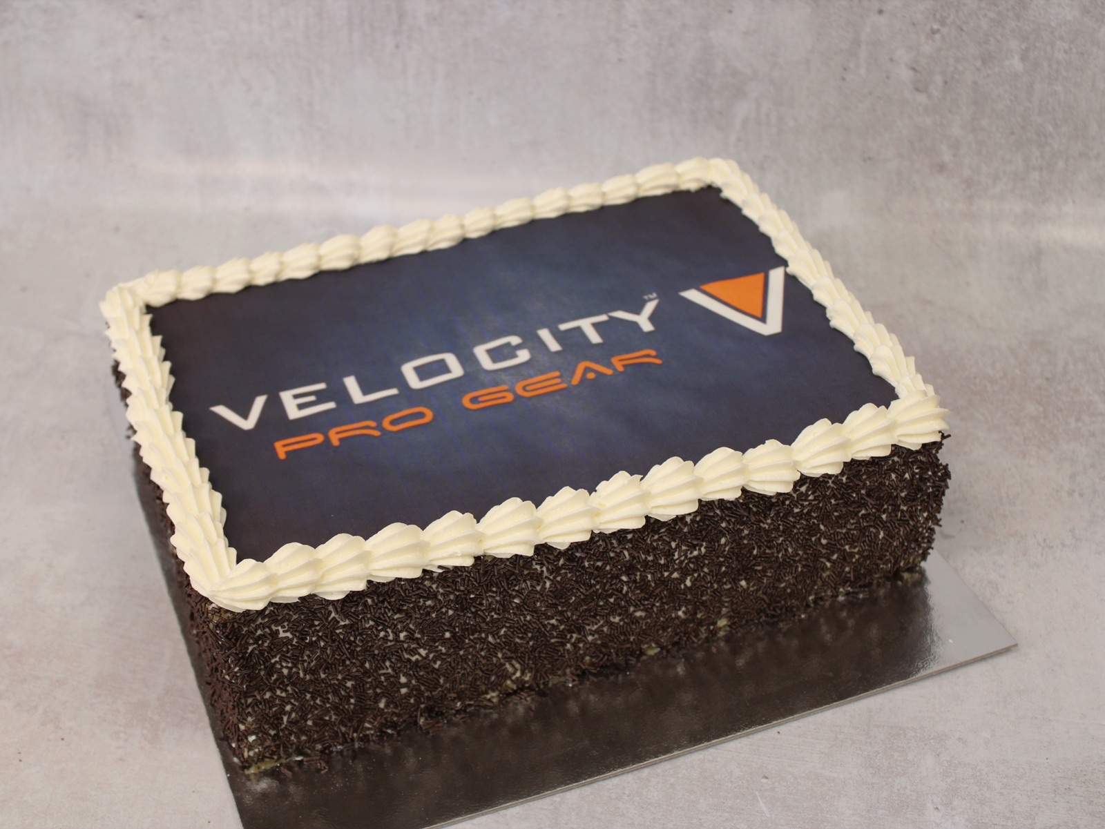Velocity Pro Gear branded corporate logo cake from Knotts Bakery